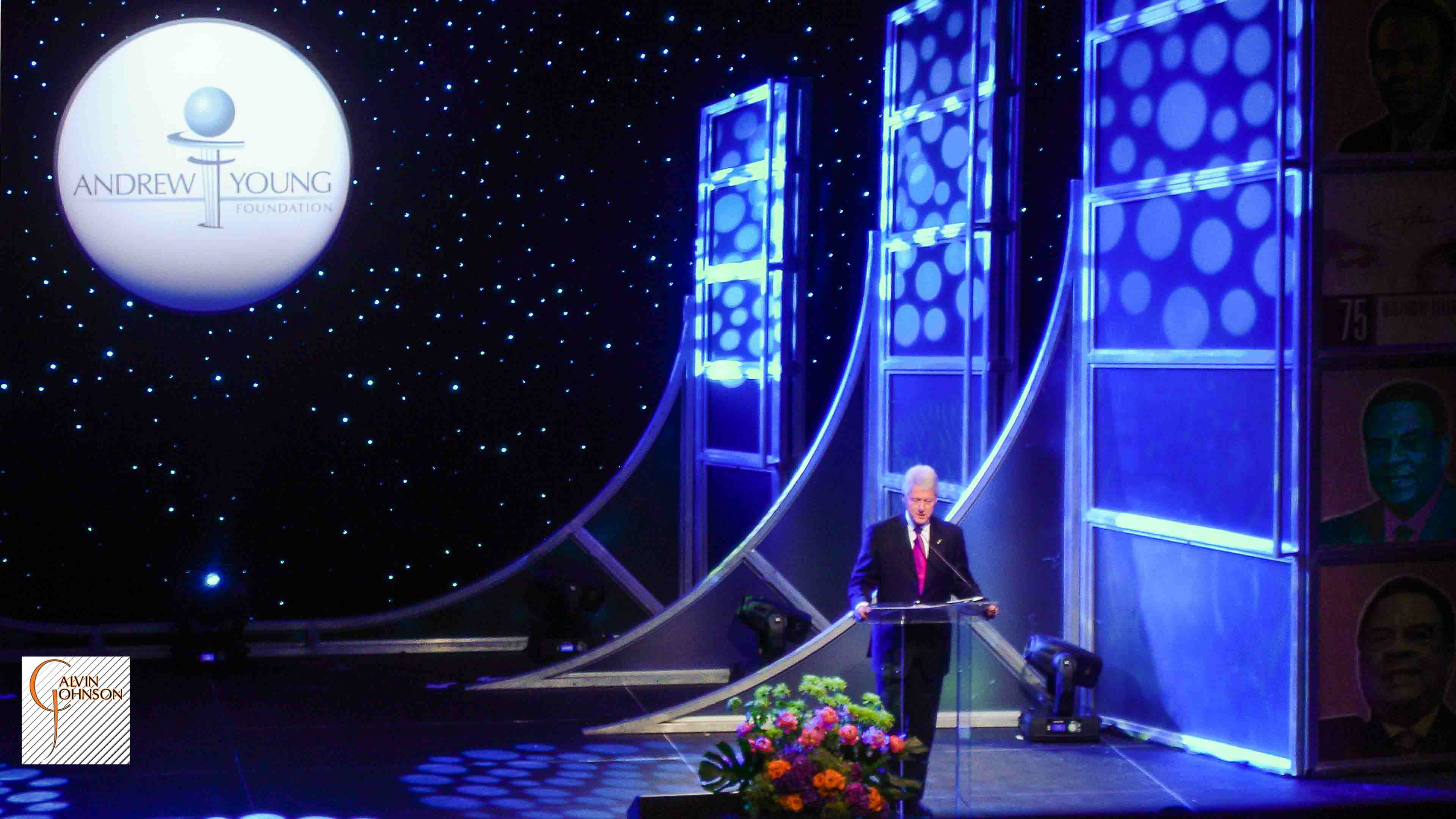 President Bill Clinton Standing at Podium Giving a Speech