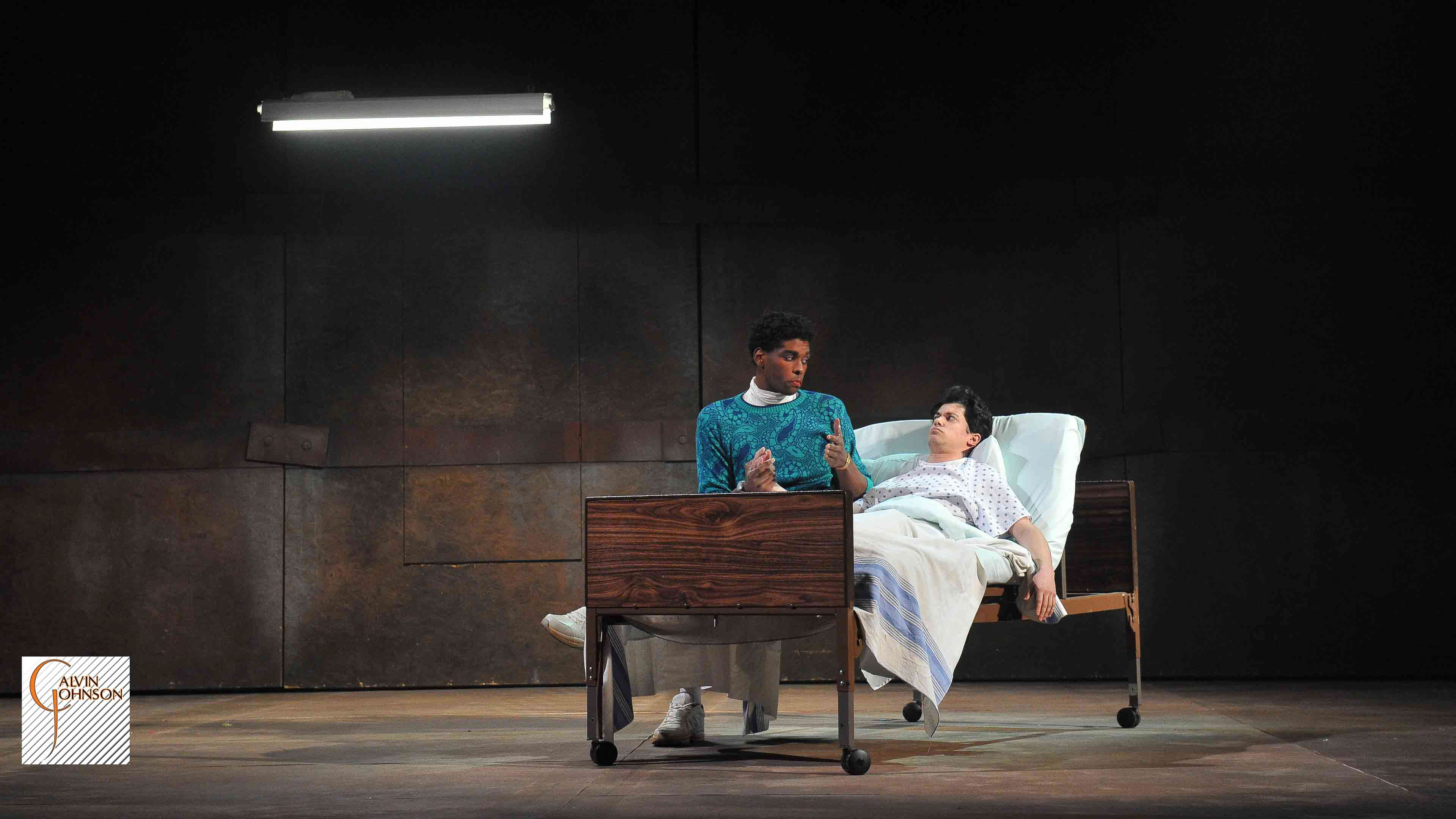 A performance of "Angels In America" at Carnegie Mellon. Prior Walter gets a visit from Belize in his hospital bed.