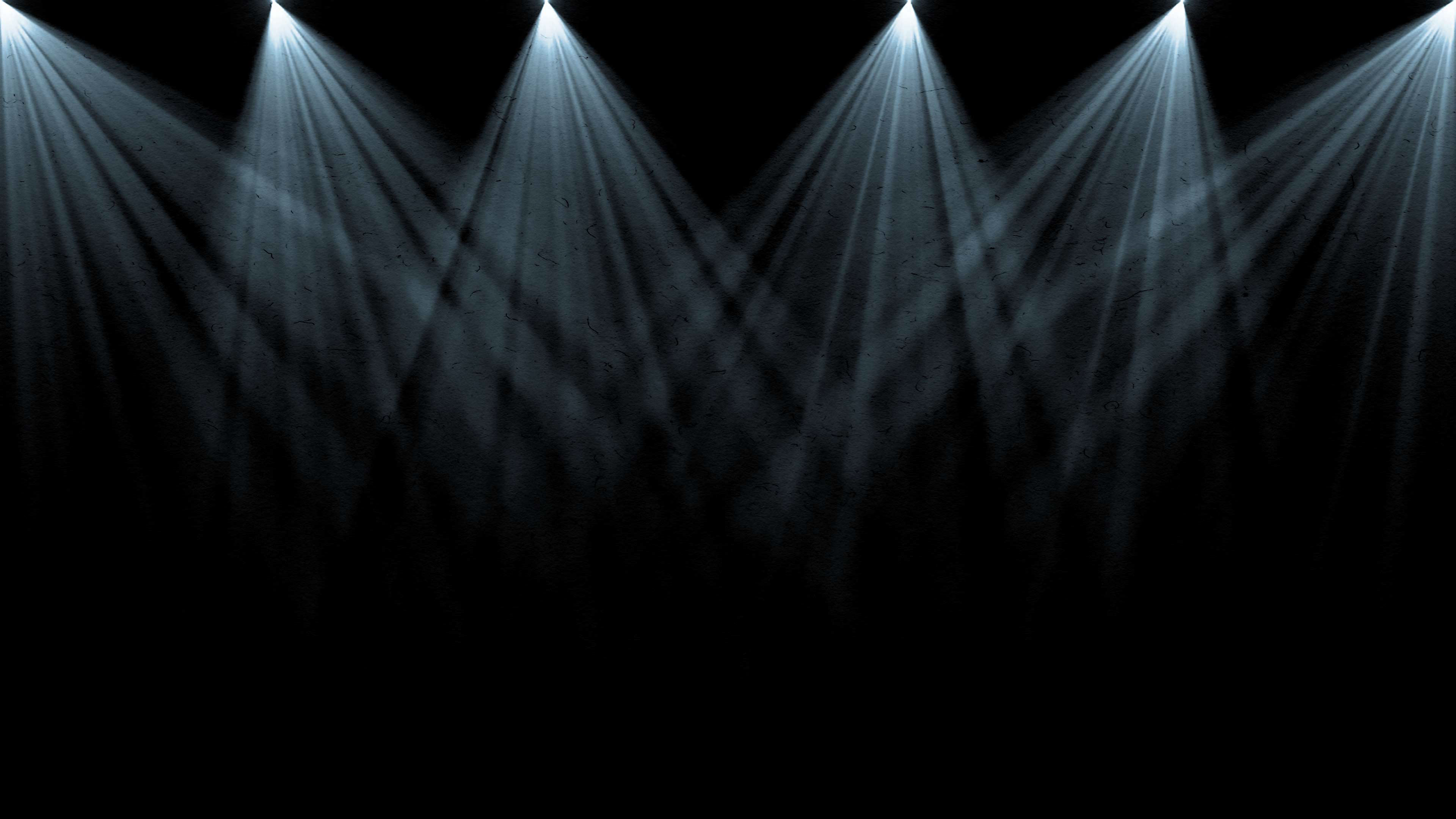 Fractured beams of light shinning from above thru haze.