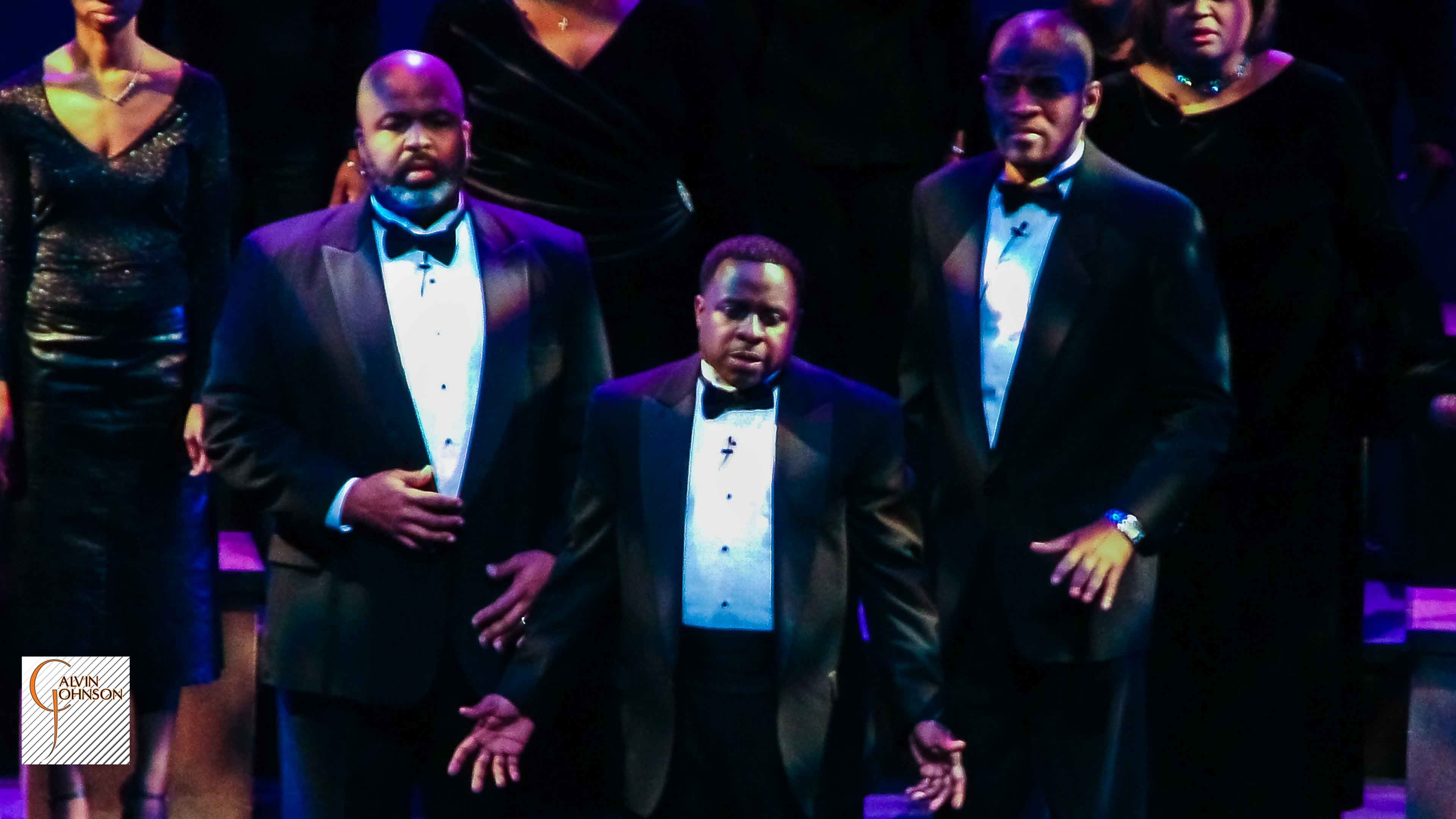 Choral members singing a musical number on stage from The Black Nativity Play.