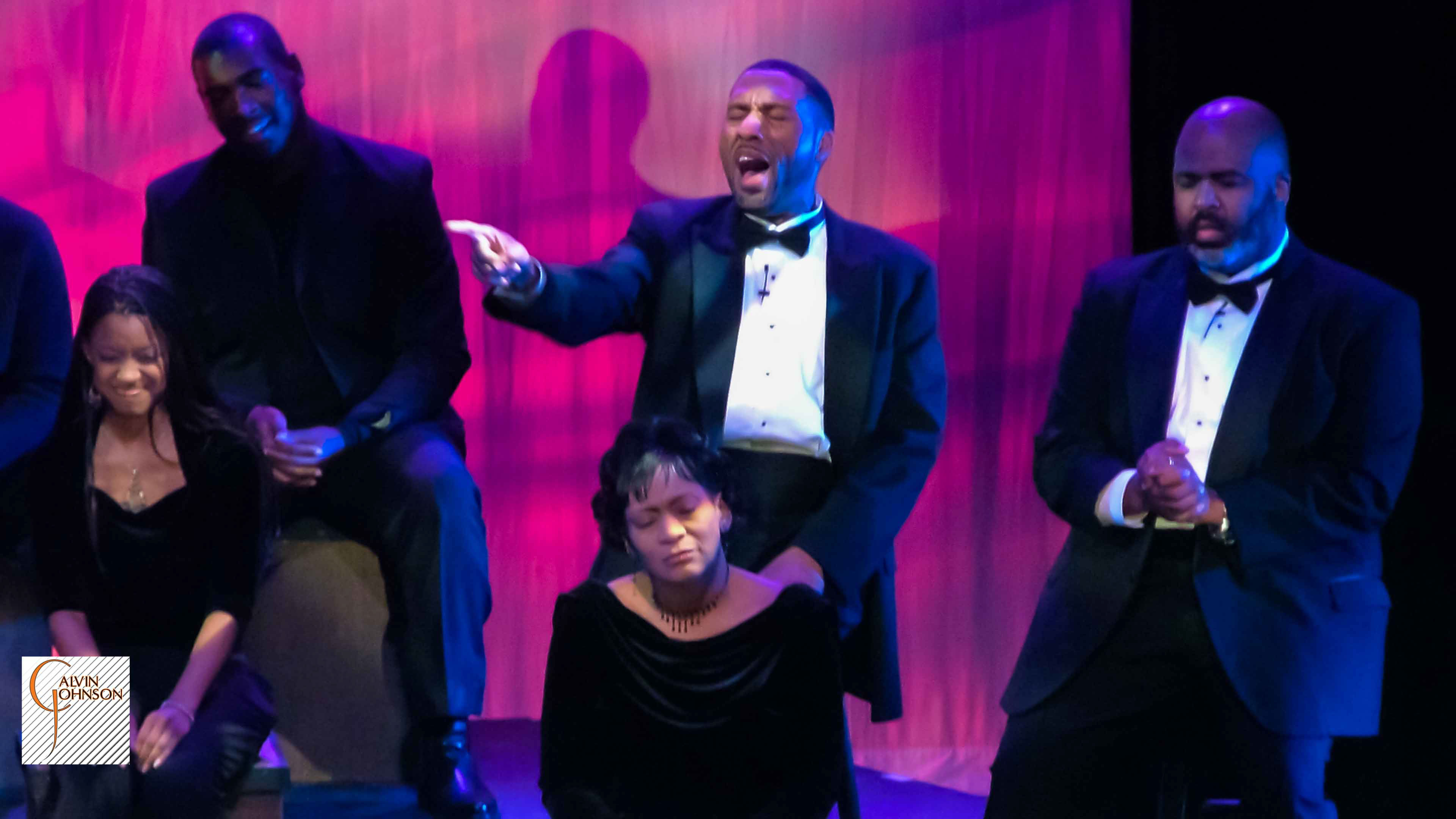 Choral members singing a musical number on stage from The Black Nativity Play.