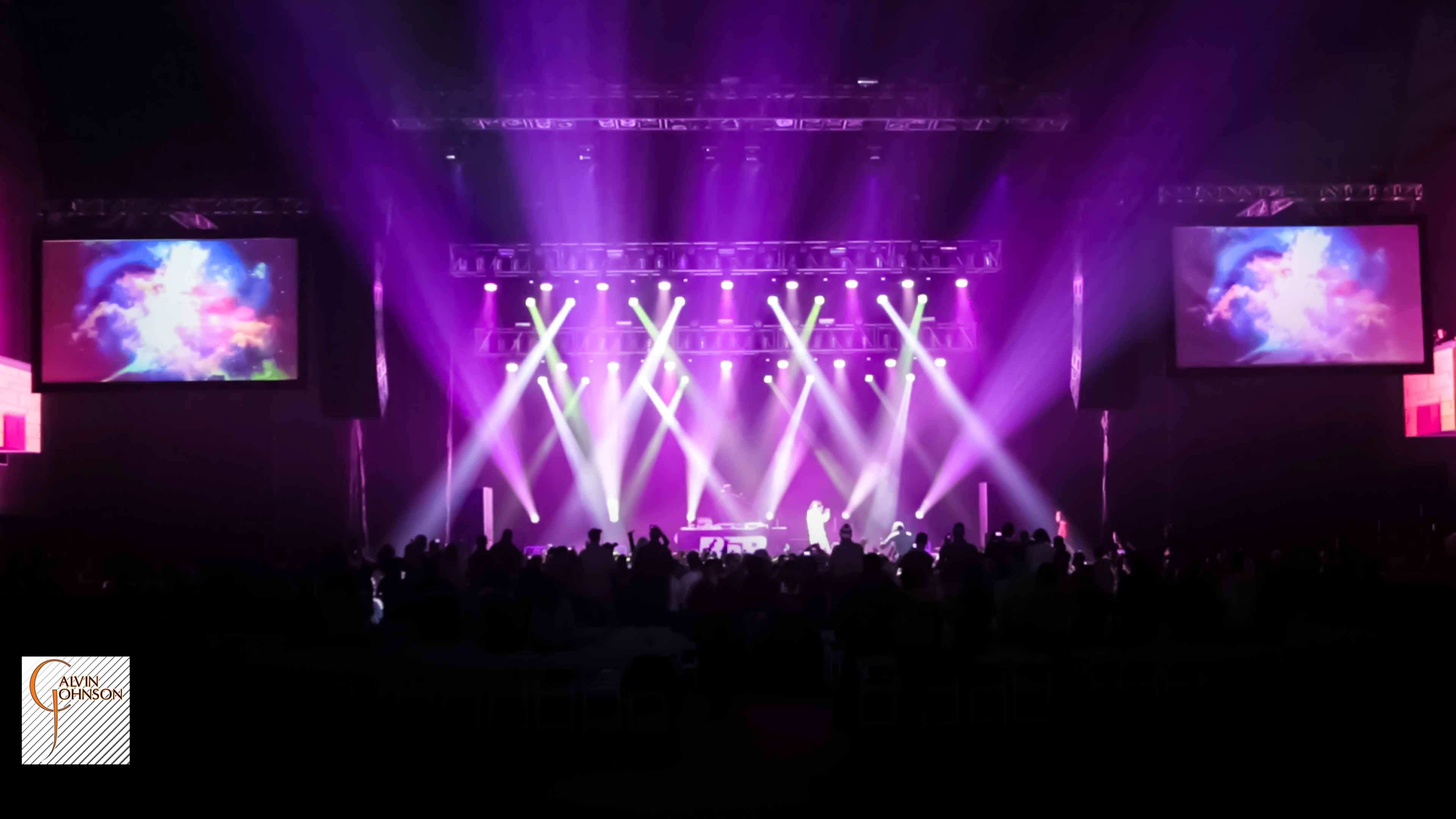 Hip Hop artist B.o.B performing at a concert with DJ Shawty Slim.