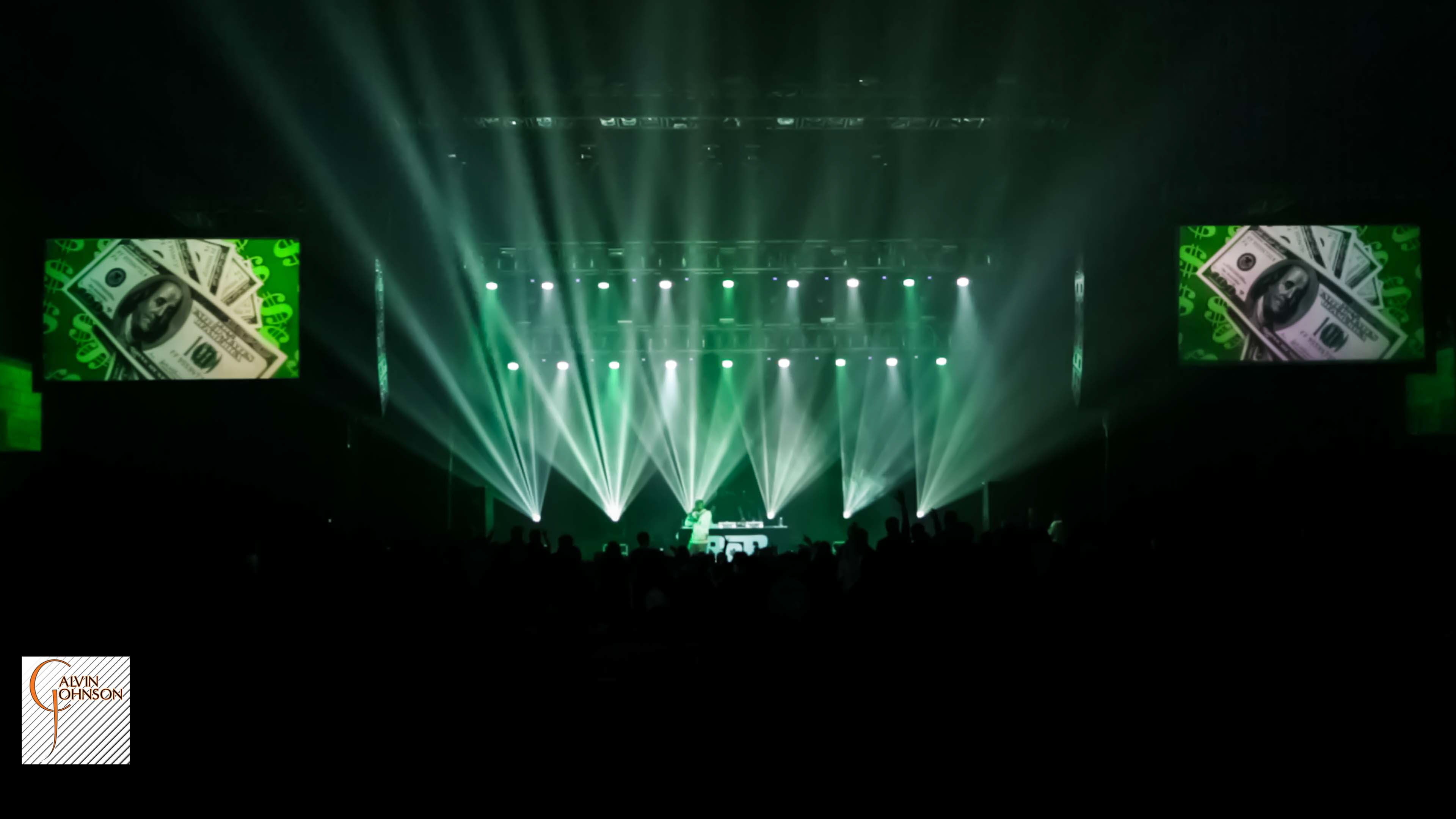 Hip Hop artist B.o.B performing at a concert with DJ Shawty Slim.