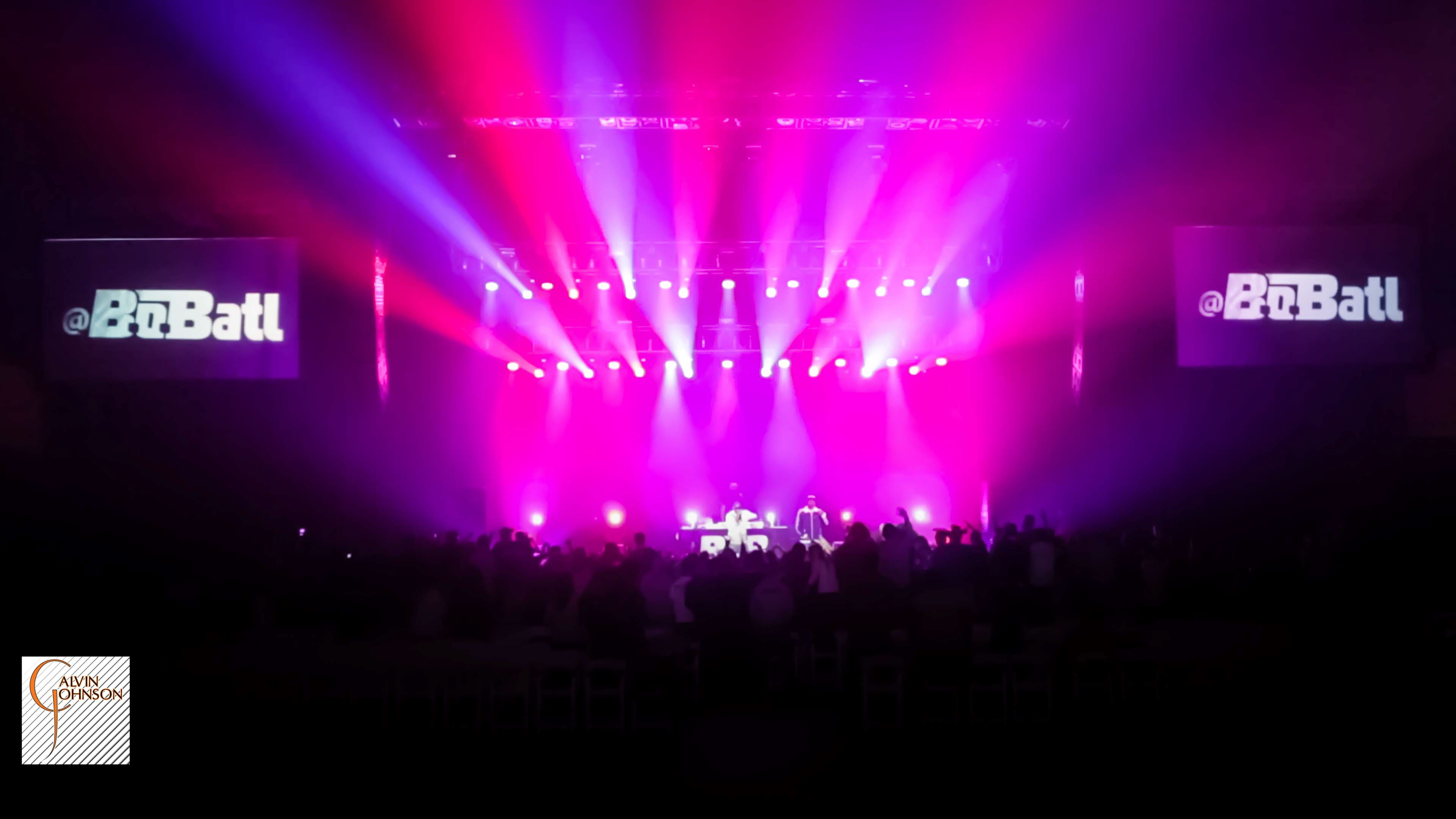 Hip Hop artist B.o.B performing at a concert with DJ Shawty Slim.