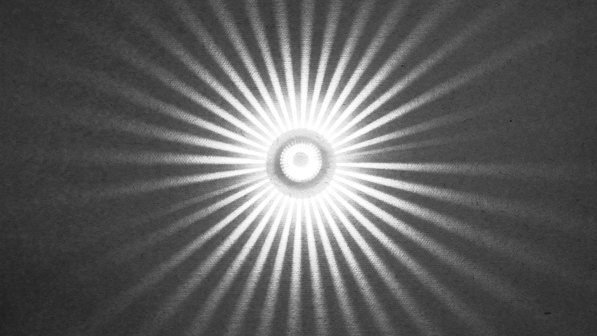 Center rays of light projecting from a wall.