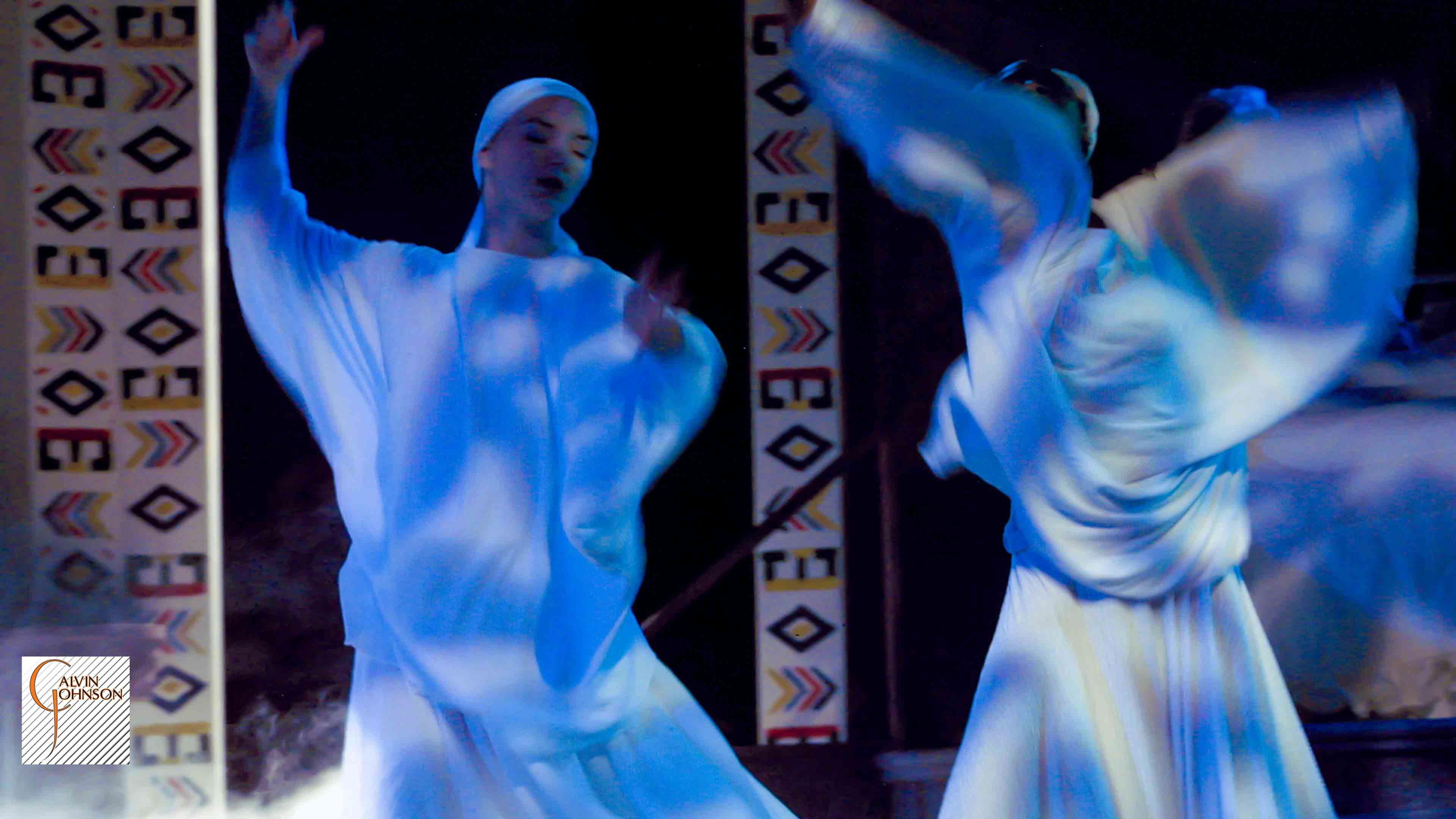 Three ghostly dancers spinning around in the play "Flying Over Purgatory"